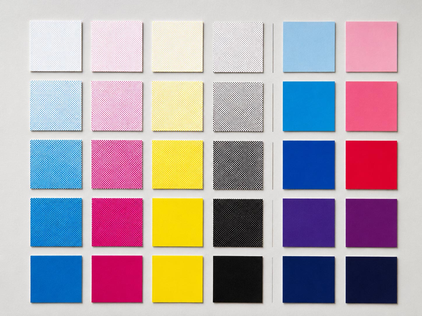 Color swatches comparing a CMYK process build against a solid spot Pantone ink, showing how printed ink reproduces color