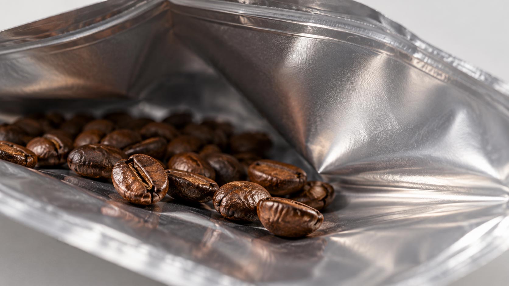 Close-up of the inner sealant layer of a coffee bag, the food-contact surface where the new PFAS limits apply