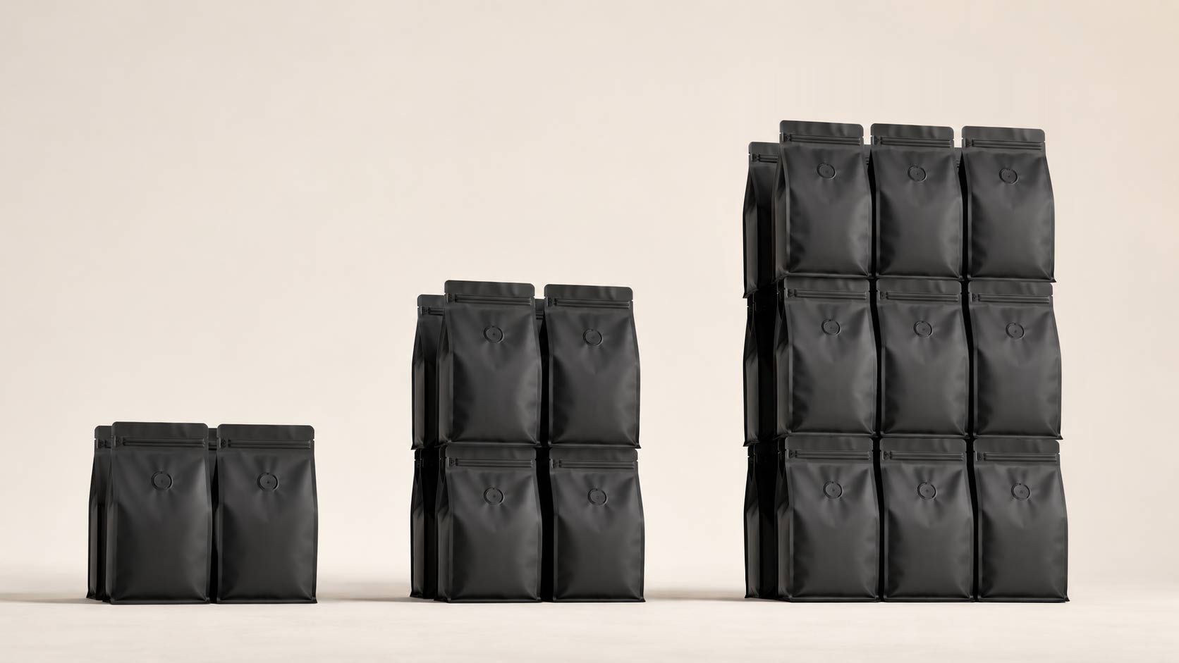 Three groups of stacked coffee bags of increasing size from left to right, representing growing order quantities across the stock, digital, and rotogravure tiers