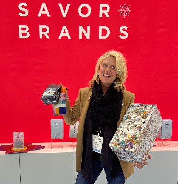 ByFusion CEO: Heidi Kujawa holding coffee bags and ByBlock. 